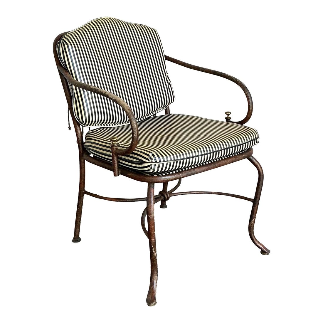 Regency Style Cast Aluminum Lounge Chair with Striped Cushion: Regency Style Cast Aluminum Lounge Chair with Striped Cushion This vintage Regency lounge chair features a cast aluminum frame with graceful curves and scrolled arms, complemented by a black-and-white