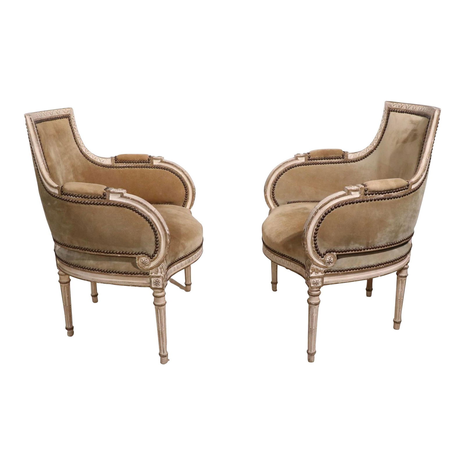 Elegant French Style Bergere Chairs in Gray Suede with Nailhead Trim: Elegant French Style Bergere Chairs in Gray Suede with Nailhead Trim Stylishly designed pair of bergere chairs, featuring a luxurious suede upholstery and elegantly carved wood frames. These chairs sh