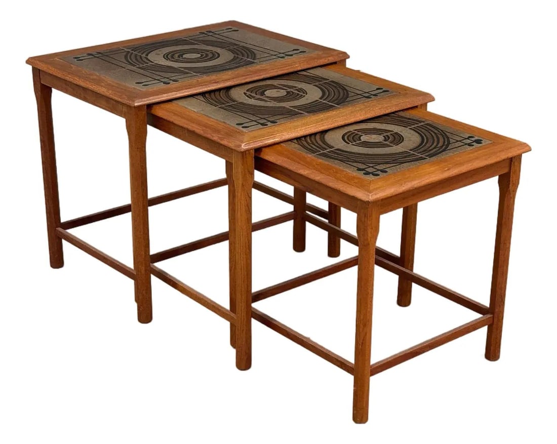 1960s Danish Modern Teak Nesting Tables Set of 3 with Tile Insert: 1960s Danish Modern Teak Nesting Tables Set of 3 with Tile Insert This exquisite set of 3 Danish Modern nesting end tables embodies the elegance of mid-century design. Crafted from high-quality teak,