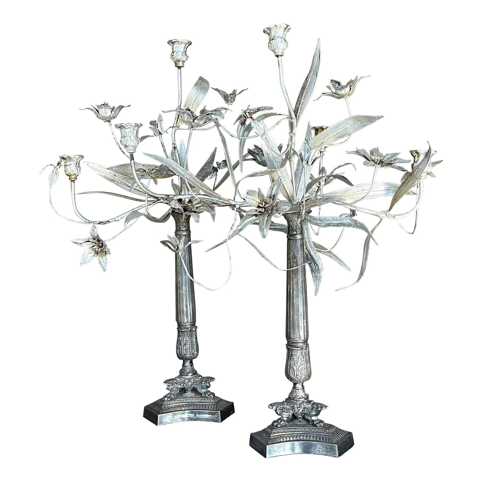 Pair of Vintage Boho Silver Floral Candelabras: Pair of Vintage Boho Silver Floral Candelabras This exquisite pair of vintage Boho candelabras showcases a stunning floral design with a chic silver leaf finish. Perfect for adding a touch of elegance