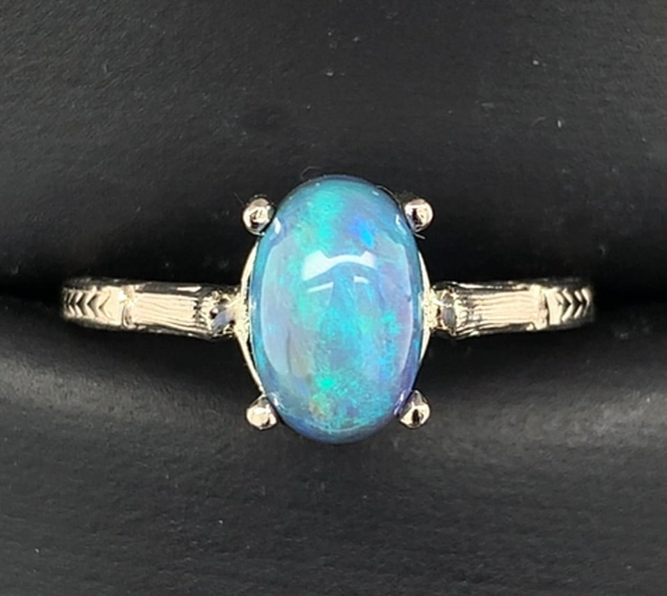 Antique 14k White Gold 2.10ct Black Opal Ring GIA Certified: Antique 14k White Gold 2.10ct Black Opal Ring GIA Certified This exquisite antique ring features a stunning 2.10-carat Australian genuine natural black opal. Crafted from 14k white gold, the opal is p