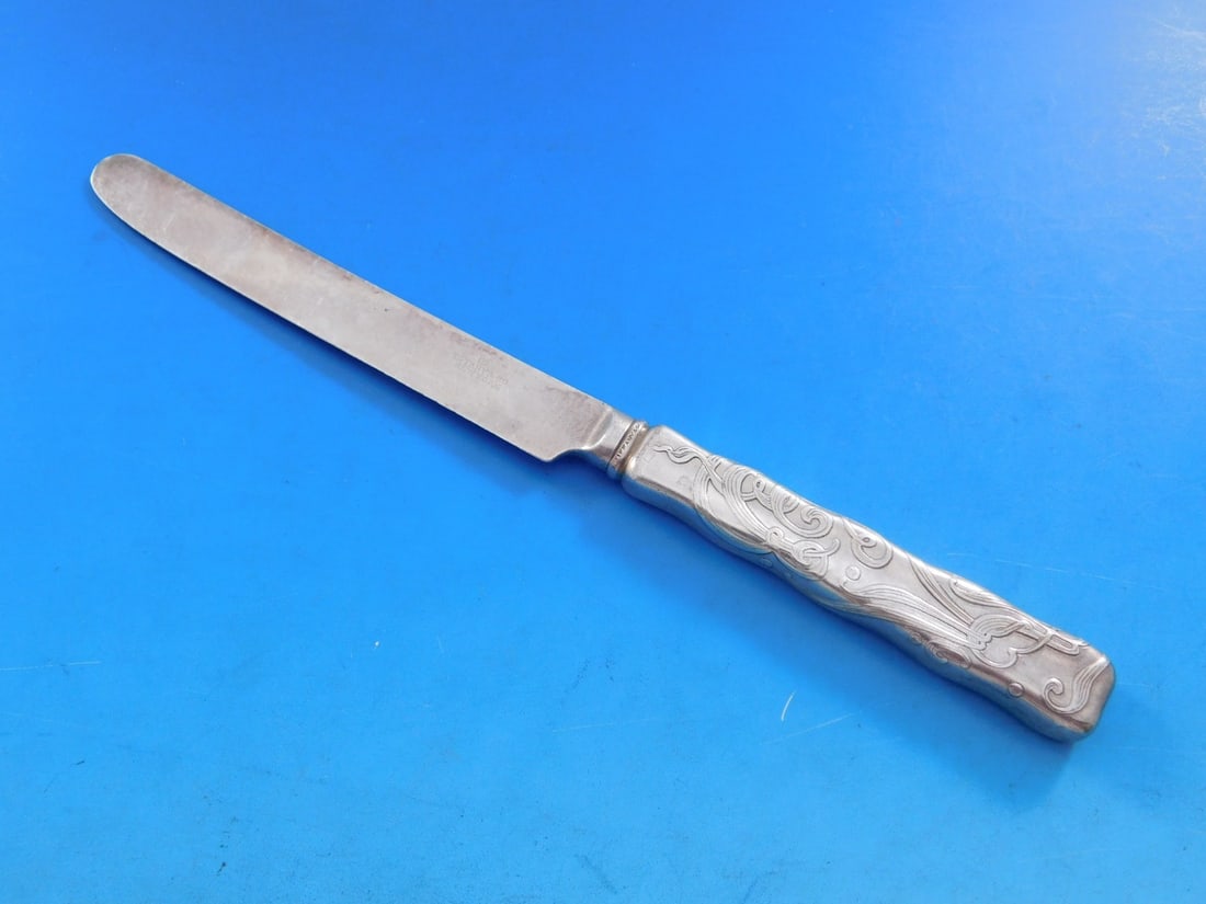 Tiffany & Co. Lap Over Edge Acid Etched Dessert Knife Sterling Silver 7.25": Tiffany & Co. Lap Over Edge Acid Etched Dessert Knife Sterling Silver 7.25" Experience the elegance of Tiffany & Co. with this vintage Lap Over Acid Etched Dessert Knife. Crafted in sterling silver, t