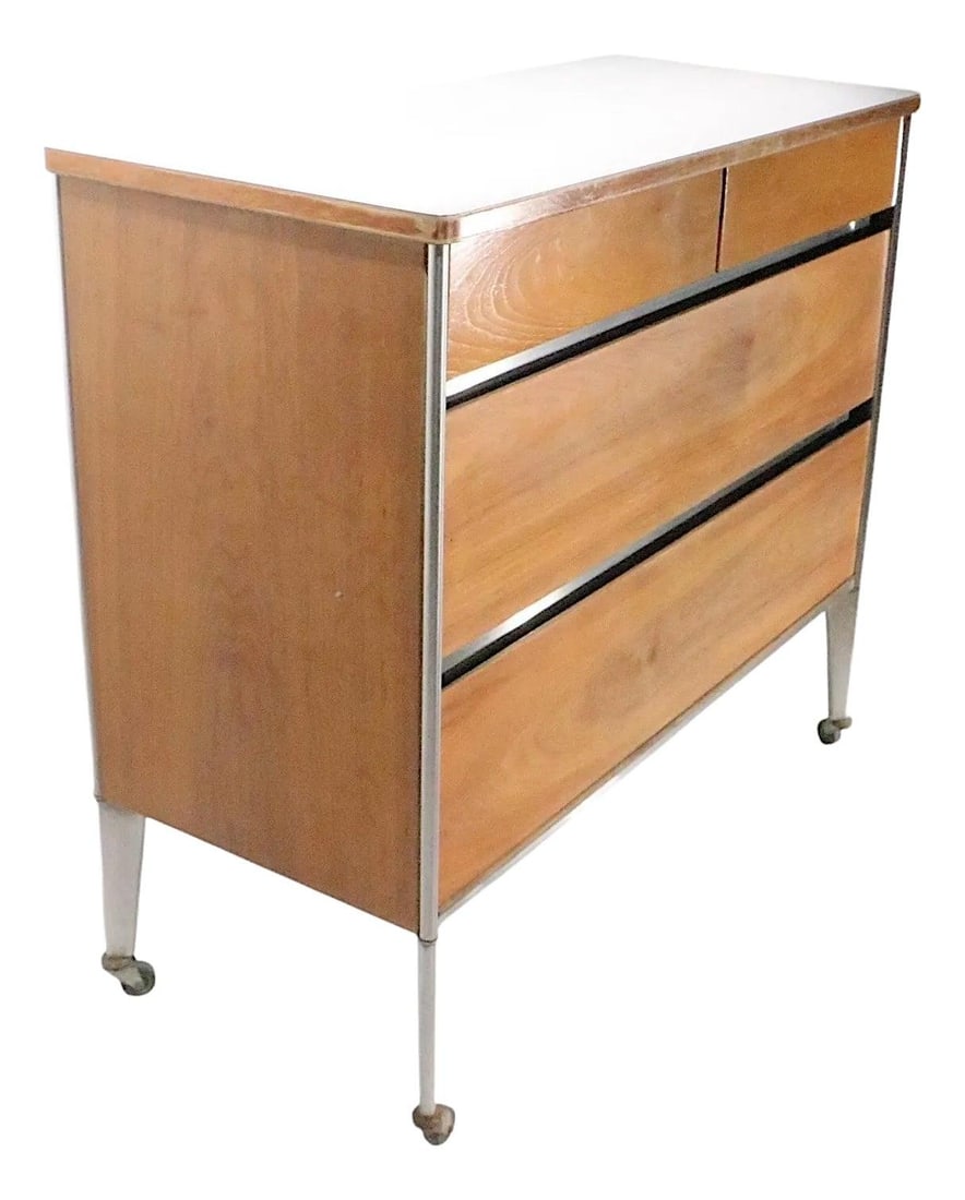 1970s Raymond Loewy Mid Century Modern Dresser Walnut Steel: 1970s Raymond Loewy Mid Century Modern Dresser Walnut Steel Discover this stunning Mid Century Modern dresser designed by the iconic Raymond Loewy for Hill Rom, dating back to the 1970s. This versatil