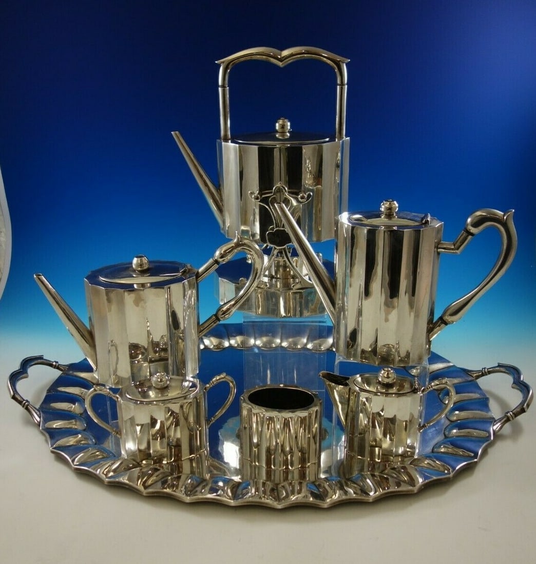 Reyes Mid-Century Modern 7pc Sterling Silver Tea Set: Reyes Mid-Century Modern 7pc Sterling Silver Tea Set Experience the elegance of mid-century design with this stunning 7-piece Mexican sterling silver tea set attributed to J. Lopez Reyes. Crafted from