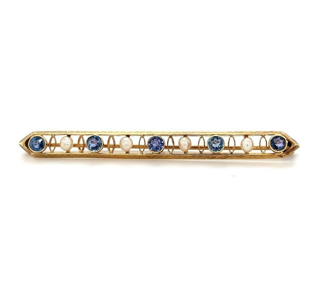 14k Yellow Gold Antique Bar Pin with Montana Sapphire and Pearl: 14k Yellow Gold Antique Bar Pin with Montana Sapphire and Pearl This exquisite 14k yellow gold antique bar pin features a stunning arrangement of five round Montana blue sapphires and four freshwater