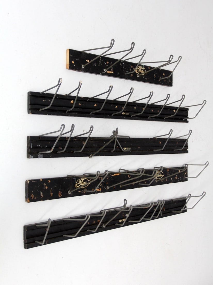 Set of 5 Vintage Gates Rubber Co. Display Racks with Steel Hooks: Set of 5 Vintage Gates Rubber Co. Display Racks with Steel Hooks Enhance your display with this set of five vintage Gates Rubber Co. display racks, perfect for showcasing belts and hoses. Crafted from