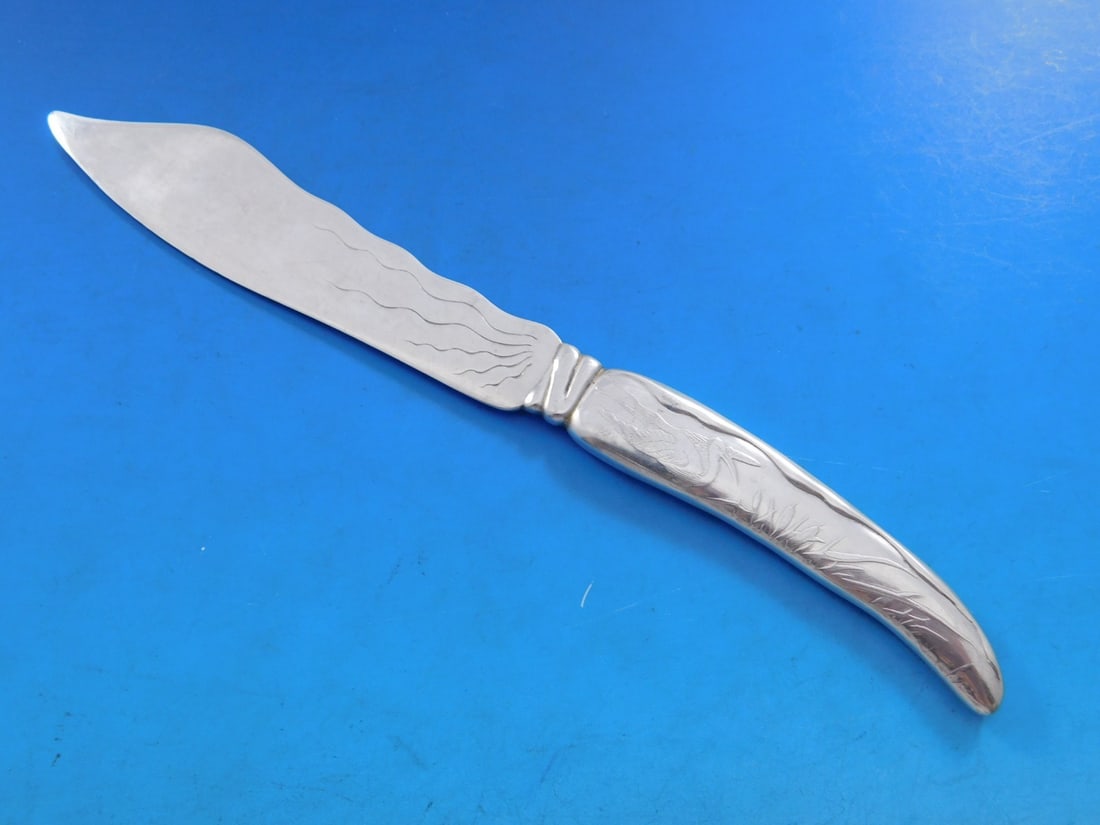 Tiffany Sterling Silver Lap Over Edge Fish Knife 7 7/8" Bird Cattails: Tiffany Sterling Silver Lap Over Edge Fish Knife 7 7/8" Bird Cattails This exquisite fish knife features a stunning Lap Over Edge pattern, acid etched by Tiffany & Co. Crafted from high-quality sterli