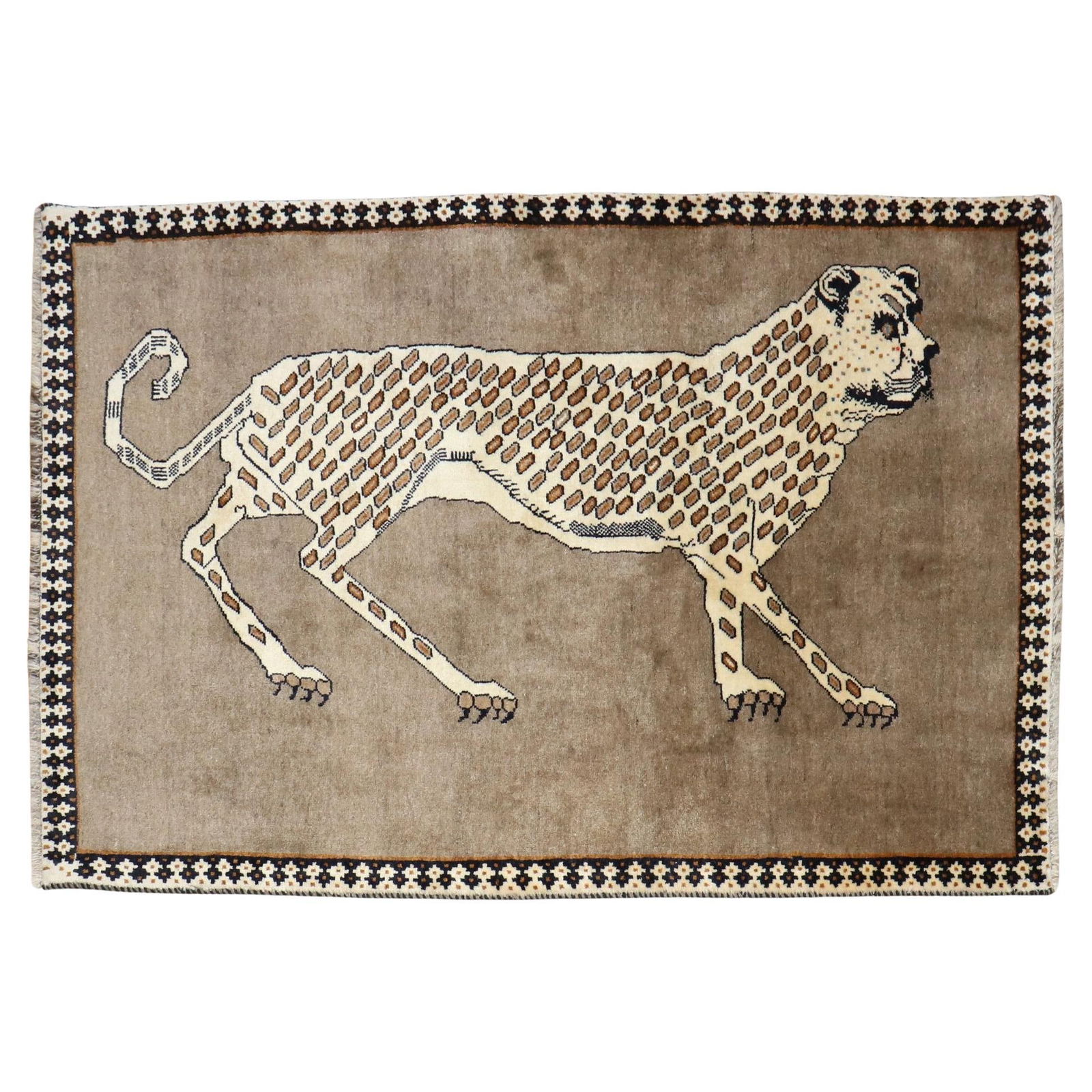 Zabihi Collection Vintage Cheetah Hand-Knotted Persian Rug 46 x 76: Zabihi Collection Vintage Cheetah Hand-Knotted Persian Rug 46 x 76 This exquisite vintage-inspired Persian rug showcases a stunning design featuring a large cheetah gracefully walking across a solid b
