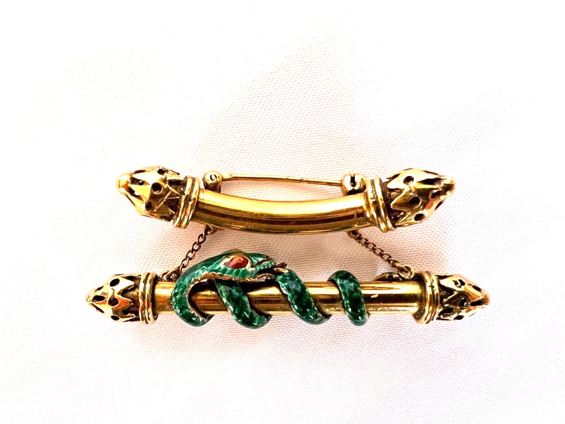 Victorian 18K Yellow Gold Enameled Snake Brooch: Victorian 18K Yellow Gold Enameled Snake Brooch This exquisite Victorian brooch features a beautifully crafted enameled snake design, showcasing intricate details and exceptional workmanship. Made fro