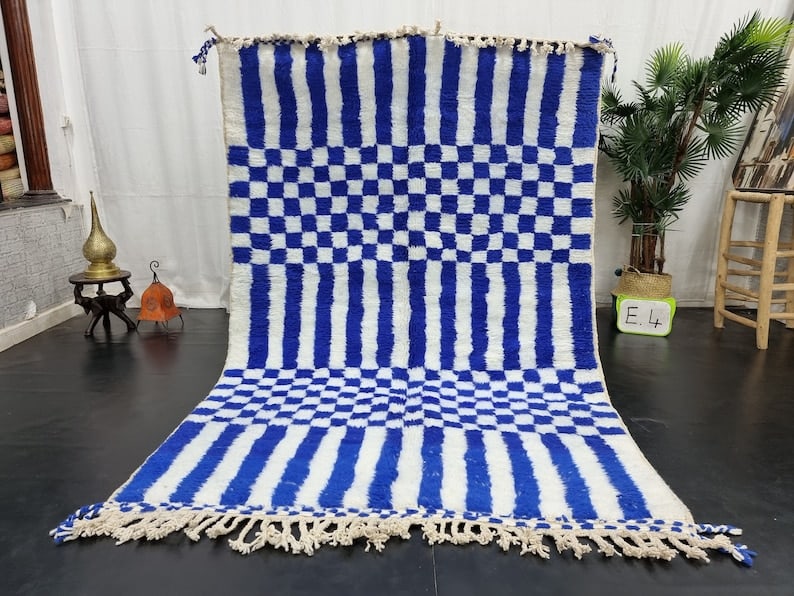 Authentic Moroccan Berber Wool Rug Soft Blue White 8x5 Feet: Authentic Moroccan Berber Wool Rug Soft Blue White 8x5 Feet Experience the beauty of craftsmanship with this stunning soft blue and white handmade Moroccan Berber wool rug. Expertly handwoven in the A