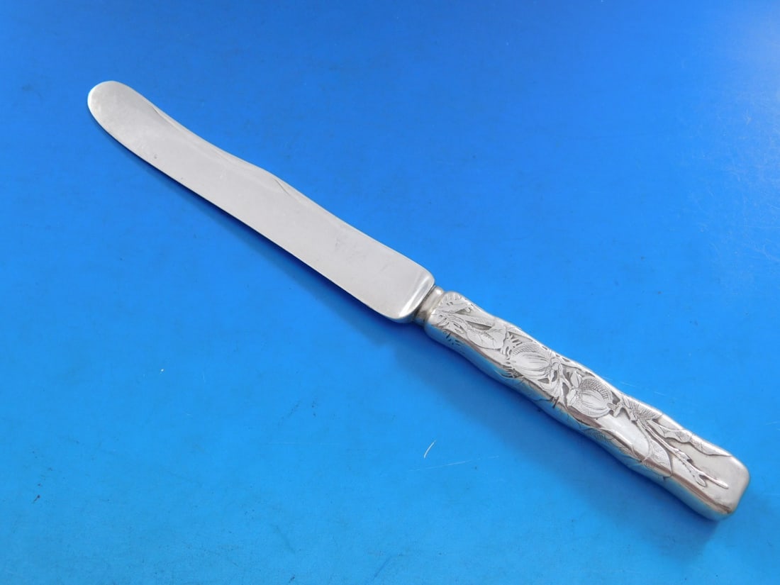 Tiffany & Co Lap Over Edge Acid Etched Sterling Silver Dessert Knife 7 1/4": Tiffany & Co Lap Over Edge Acid Etched Sterling Silver Dessert Knife 7 1/4" This exquisite dessert knife features the classic Lap Over Edge pattern, expertly crafted by Tiffany & Co. Made from high-qu