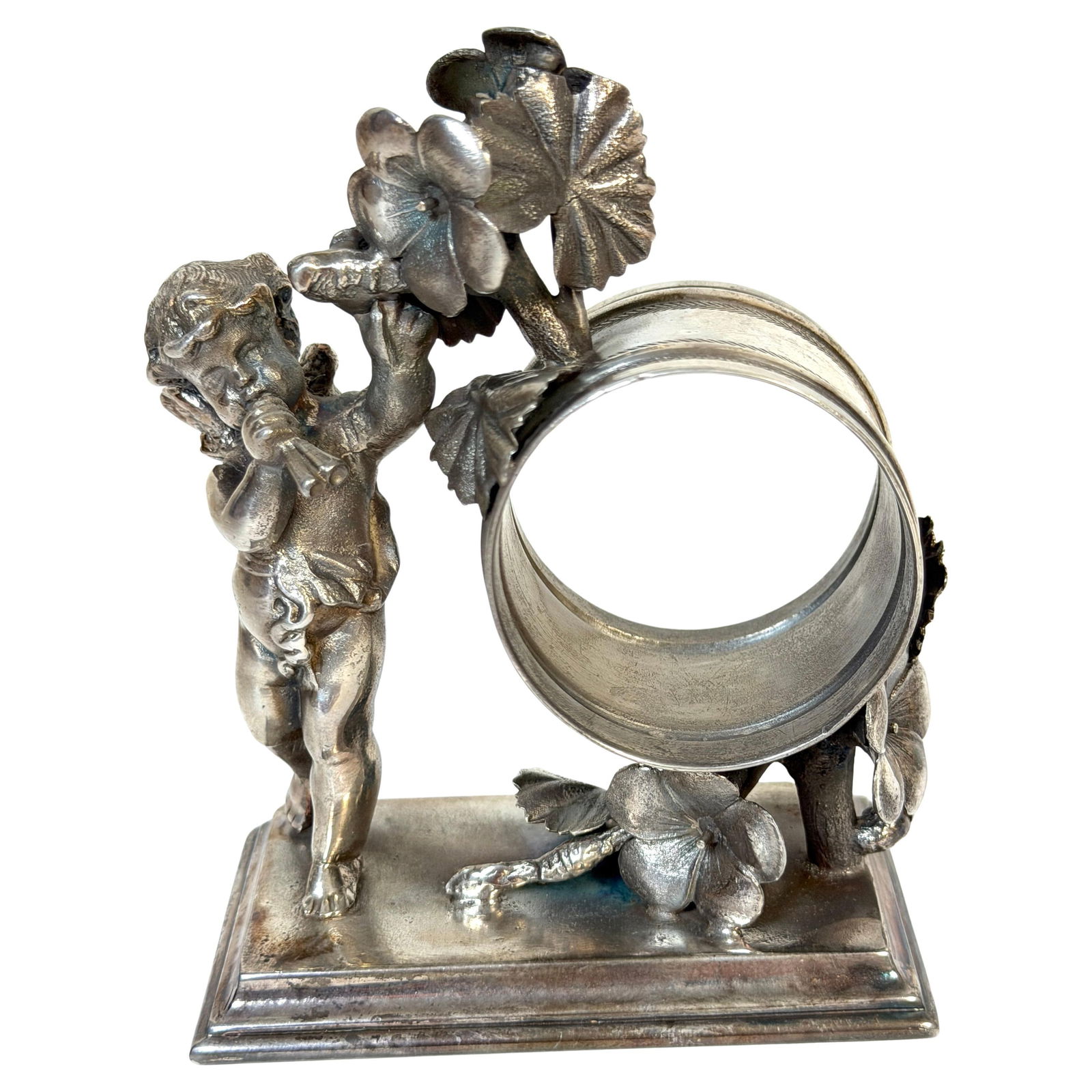 Cherub Figural Silverplate Napkin Ring High Victorian by Simpson Hall Miller: Cherub Figural Silverplate Napkin Ring High Victorian by Simpson Hall Miller This Victorian figural napkin ring, crafted by Simpson, Hall & Miller in the late 19th century, features a finely cast cher
