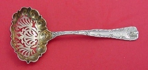 Tiffany & Co. Wave Edge Sterling Silver Sugar Sifter 5 3/4" Gold-Washed: Tiffany & Co. Wave Edge Sterling Silver Sugar Sifter 5 3/4" Gold-Washed This exquisite sugar sifter features the iconic Wave Edge pattern by Tiffany & Co. Crafted from high-quality sterling silver, th