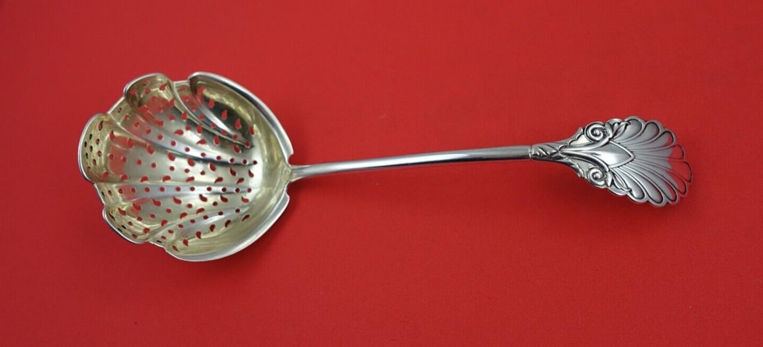 Grecian Gorham Sterling Silver Sugar Sifter Ladle 8.25in Monogrammed: Grecian Gorham Sterling Silver Sugar Sifter Ladle 8.25in Monogrammed Introducing the Grecian by Gorham Sterling Silver Sugar Sifter Ladle, measuring 8 1/4 inches. This elegant ladle features a classic