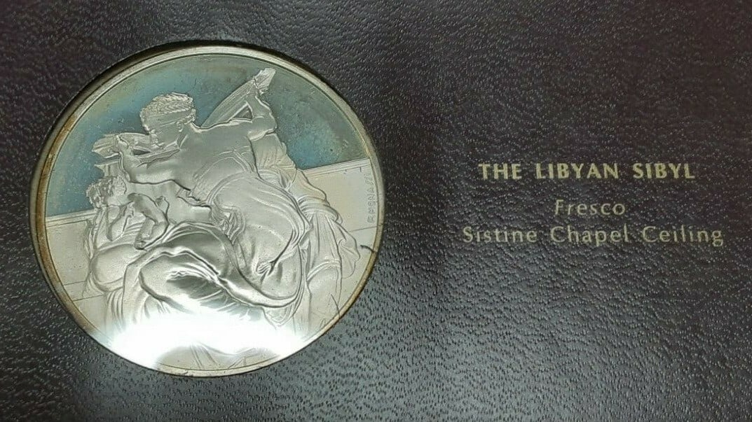 Sterling Silver Medal Featuring Michelangelo Libyan Sibyl by Franklin Mint: Sterling Silver Medal Featuring Michelangelo Libyan Sibyl by Franklin Mint This Franklin Mint Genius of Michelangelo proof medal features The Libyan Sibyl from Michelangelo's frescoes in the Sistine C