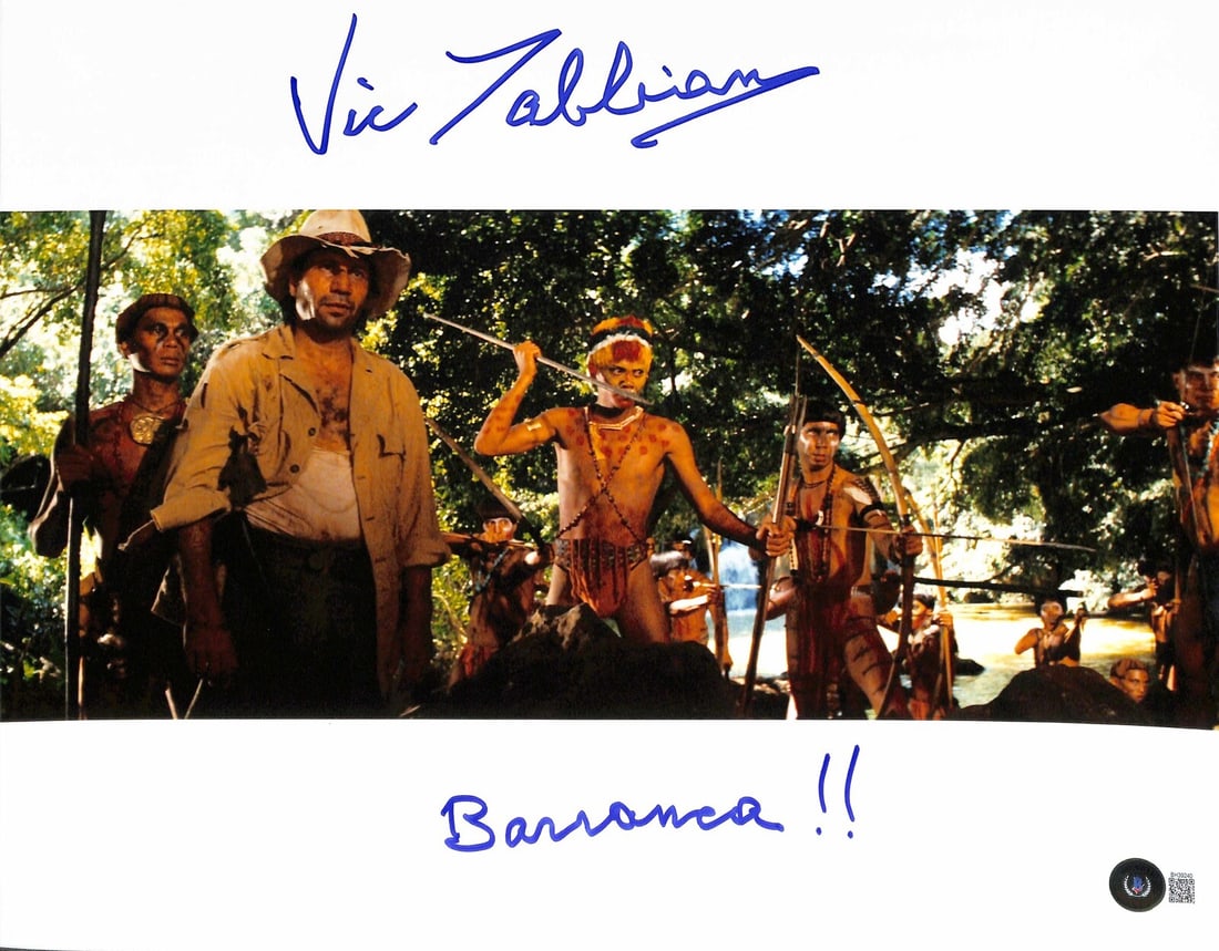 Vic Tablian Signed Barranca 11x14 Photo Beckett Authenticated: Vic Tablian Signed Barranca 11x14 Photo Beckett Authenticated This is an original 11x14 color photograph featuring Vic Tablian as Barranca from Indiana Jones: Raiders of the Lost Ark. The photograph i