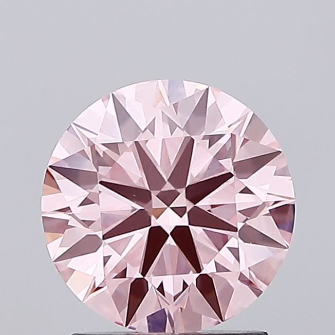 Ideal Loose Diamond - ROUND 1.69ct Fancy Vivid Pink VS1: Ideal Loose Diamond - ROUND 1.69ct Fancy Vivid Pink VS1 Source: This is a real non-mined Diamond that has been grown in a lab Shape: ROUND Carats: 1.69 Color: Fancy Vivid Pink Certification: IGI Video