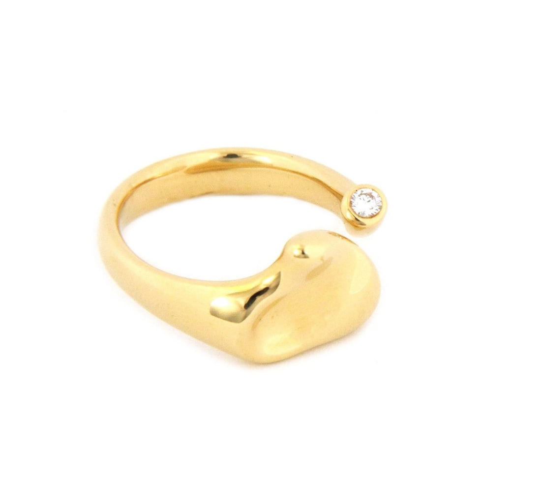 Tiffany & Co Elsa Peretti 18k Yellow Gold Cuff Ring with Diamond 5 Points: Tiffany & Co Elsa Peretti 18k Yellow Gold Cuff Ring with Diamond 5 Points This exquisite cuff ring from Tiffany & Co., designed by Elsa Peretti, showcases a stunning full heart design. Made from high-