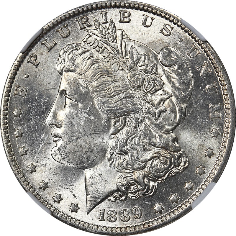 1889-O Morgan Silver Dollar NGC MS62 Uncirculated Silver Coin: 1889-O Morgan Silver Dollar NGC MS62 Uncirculated Silver Coin This 1889-O Morgan Silver Dollar is a remarkable piece, showcasing exceptional eye appeal with its brilliant luster and strong strike. The