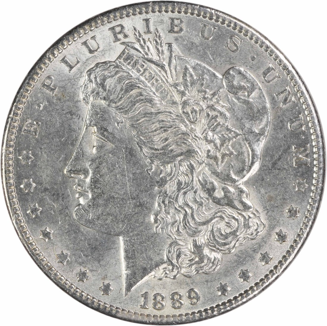 AU Morgan Dollar 1889 Philadelphia 90 Percent Silver Uncertified: AU Morgan Dollar 1889 Philadelphia 90 Percent Silver Uncertified This 1889 Morgan Silver Dollar was struck at the Philadelphia Mint and features a composition of 90% silver and 10% copper. Designed by
