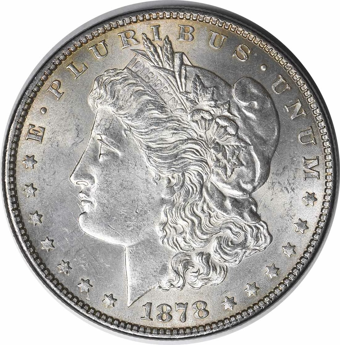 1878 Morgan Silver Dollar 7TF Reverse Choice Brilliant Uncirculated: 1878 Morgan Silver Dollar 7TF Reverse Choice Brilliant Uncirculated This 1878 Morgan Silver Dollar features a striking design and is categorized as a Choice BU (Brilliant Uncirculated) coin. It is