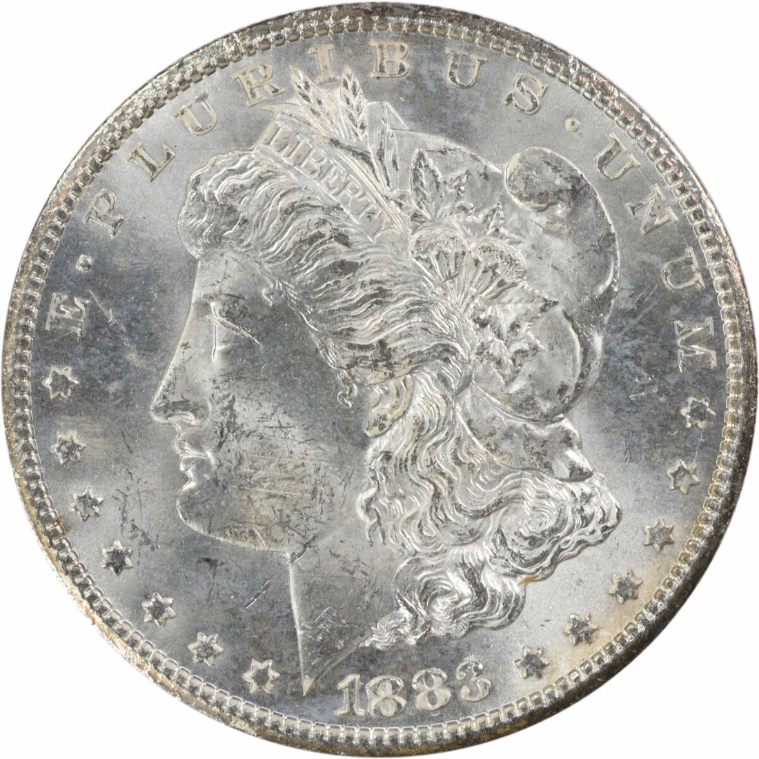 1883-CC Morgan Silver Dollar Brilliant Uncirculated Uncertified: 1883-CC Morgan Silver Dollar Brilliant Uncirculated Uncertified This 1883-CC Morgan Silver Dollar is a stunning example of numismatic artistry. It features a brilliant uncirculated finish and is compo