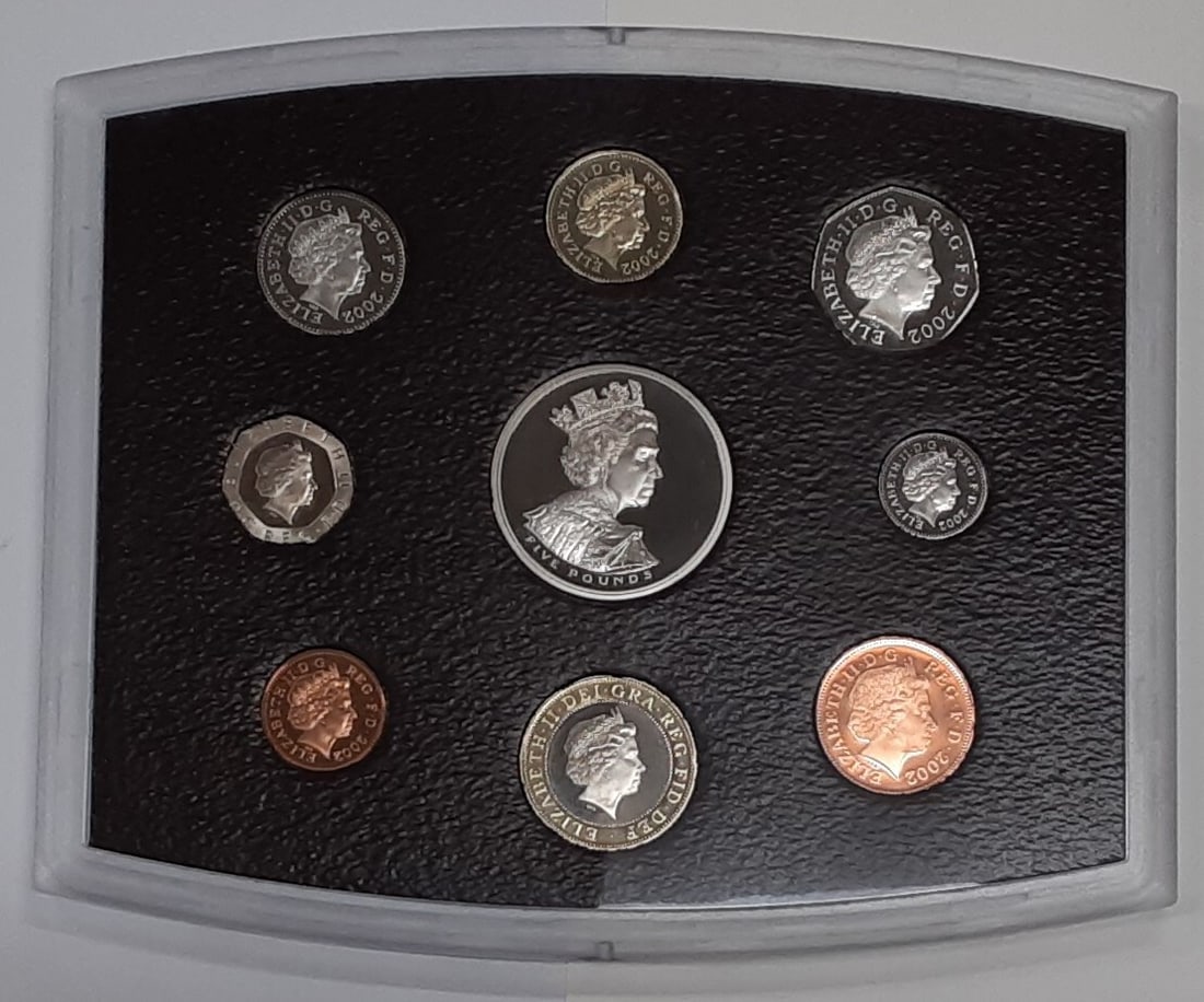 Nine Piece 2002 United Kingdom Proof Coin Set in Blue Box With COA: Nine Piece 2002 United Kingdom Proof Coin Set in Blue Box With COA This 2002 Royal Mint Blue Box United Kingdom Proof Coin Collection includes nine uncirculated proof coins, presented in original Roya