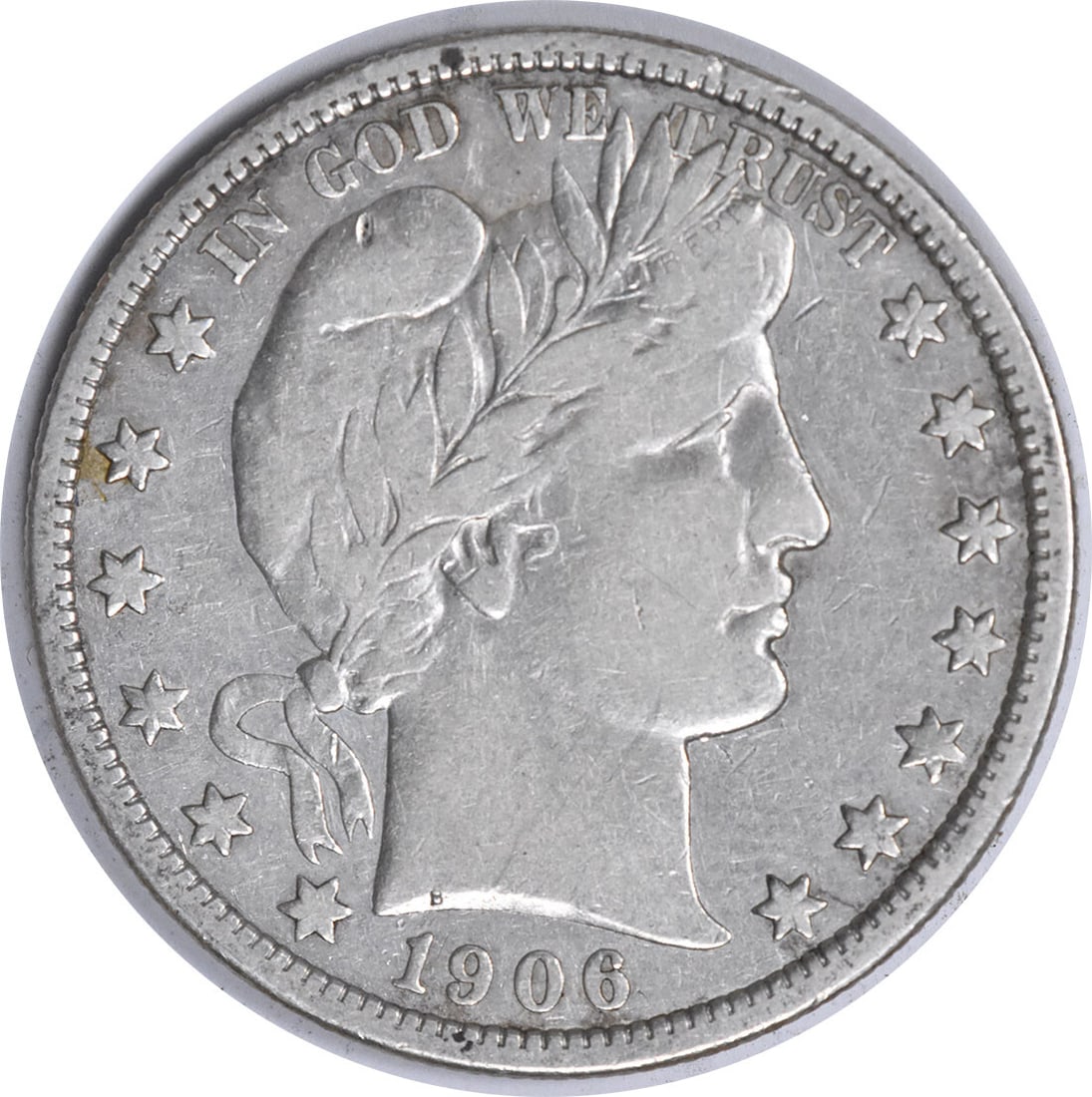 1906-D Barber Silver Half Dollar 50C Uncertified Coin by Charles E. Barber: 1906-D Barber Silver Half Dollar 50C Uncertified Coin by Charles E. Barber This 1906-D Barber Silver Half Dollar is a vintage piece, representing a significant era in American coinage. The coin featur