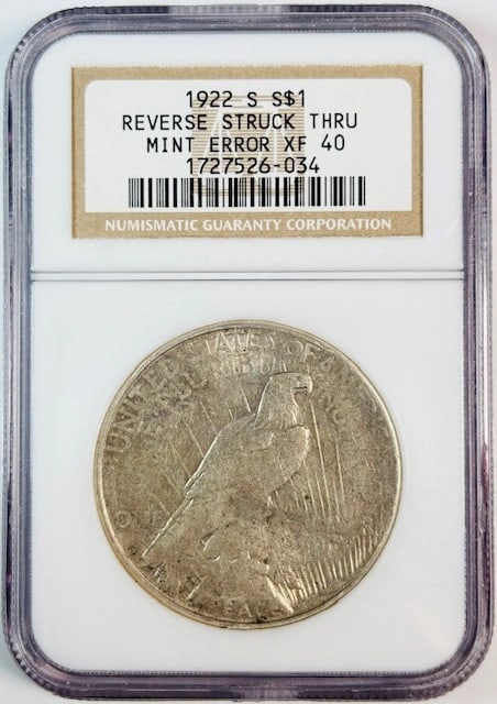 NGC XF 40 1922 San Francisco Peace Silver Dollar Reverse Struck Through: NGC XF 40 1922 San Francisco Peace Silver Dollar Reverse Struck Through This is a 1922 S Peace Dollar graded XF-40 by NGC, featuring a reverse struck thru error. The coin is composed of silver, was mi