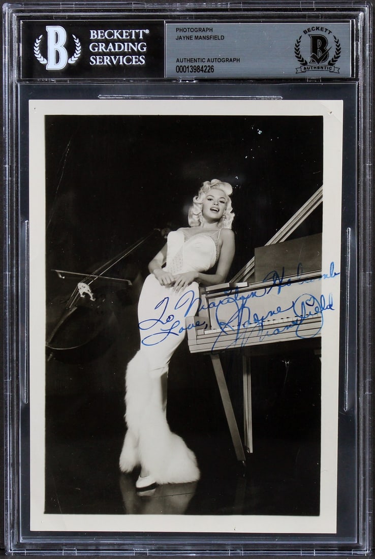 Jayne Mansfield Signed 5x7 B&W Photo To Marilyn Holcomb BAS Authenticated: Jayne Mansfield Signed 5x7 B&W Photo To Marilyn Holcomb BAS Authenticated This stunning 5x7 black and white photograph captures the essence of Jayne Mansfield, featuring her personal inscription "To M