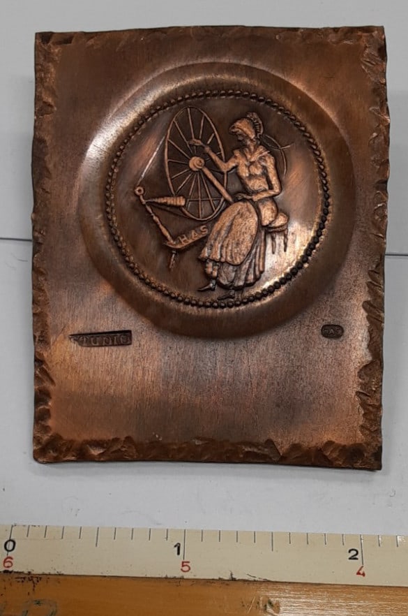 Copper Medal by H Alvin Sharpe Depicting Colonial Woman at Spinning Wheel: Copper Medal by H Alvin Sharpe Depicting Colonial Woman at Spinning Wheel This vintage studio trial plate from the 1960s was created by H. Alvin Sharpe and features a detailed design of a Colonial wom