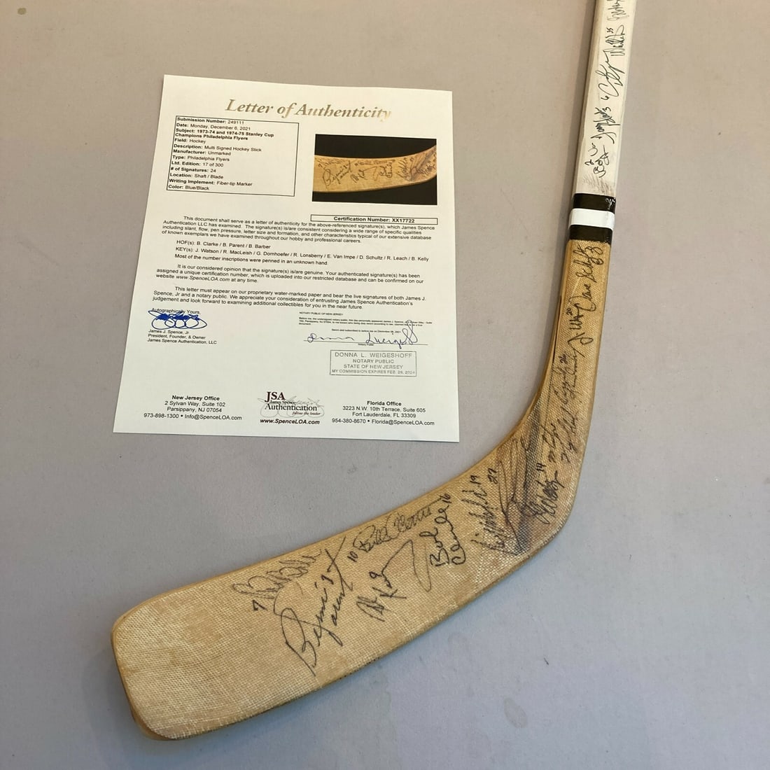 1974-75 Flyers Signed Hockey Stick with 24 Signatures JSA COA: 1974-75 Flyers Signed Hockey Stick with 24 Signatures JSA COA Celebrate the legacy of the 1974-75 Philadelphia Flyers with this original team signed hockey stick. This commemorative stick features the