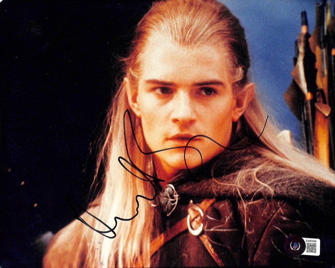 Orlando Bloom Legolas Signed 8x10 Photo Beckett Certified: Orlando Bloom Legolas Signed 8x10 Photo Beckett Certified This stunning autographed 8x10 photograph features Orlando Bloom as Legolas from the iconic Lord of the Rings film series. The photograph is s