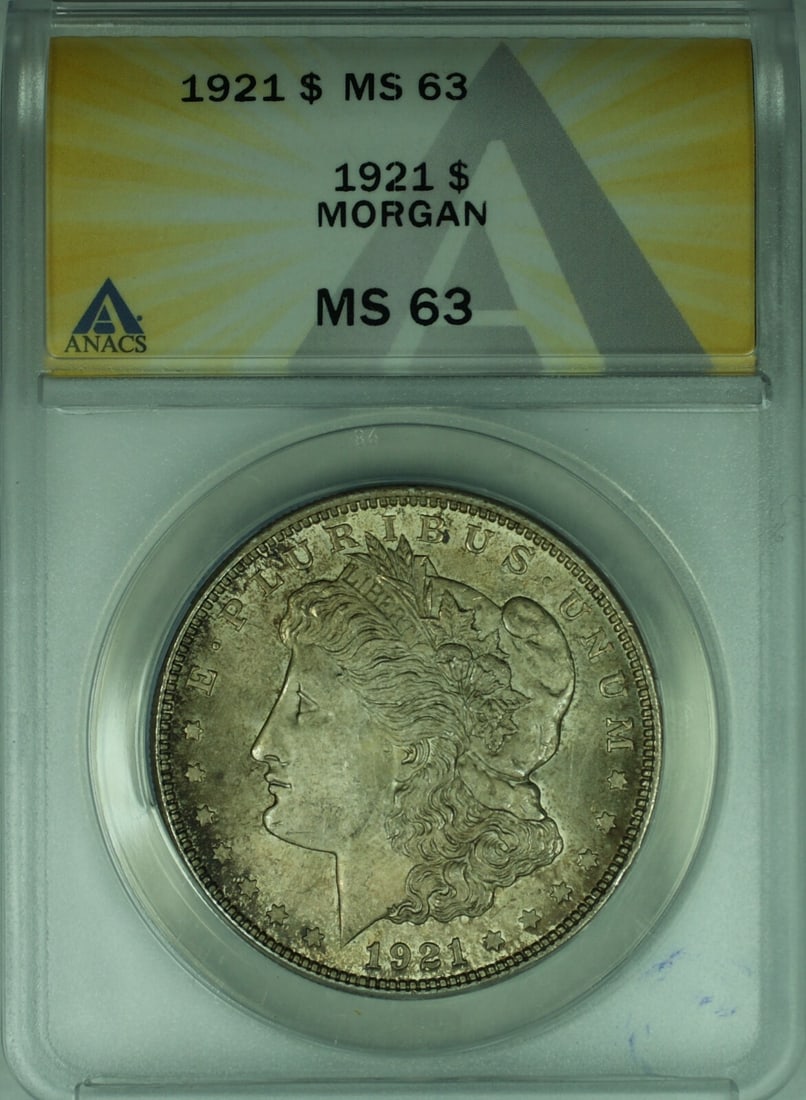 1921 Philadelphia Morgan Dollar ANACS MS 63 Uncirculated Silver Toned Coin: 1921 Philadelphia Morgan Dollar ANACS MS 63 Uncirculated Silver Toned Coin This 1921 Morgan Silver Dollar features beautiful toning and has been graded MS-63 by ANACS. Struck in Philadelphia, this unc