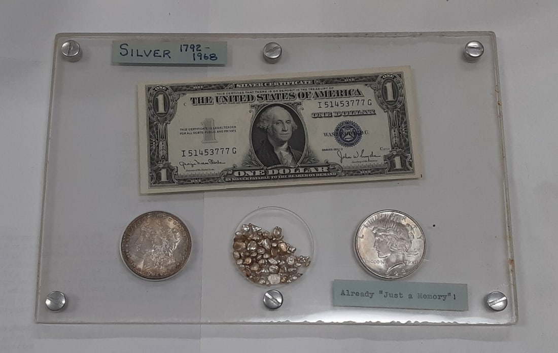 United States Silver Collection Morgan and Peace Dollars Silver Certificate Granules Set: United States Silver Collection Morgan and Peace Dollars Silver Certificate Granules Set This United States silver set features an uncirculated 1902-O Morgan Dollar, a 1923 Peace Dollar, a Series 1935