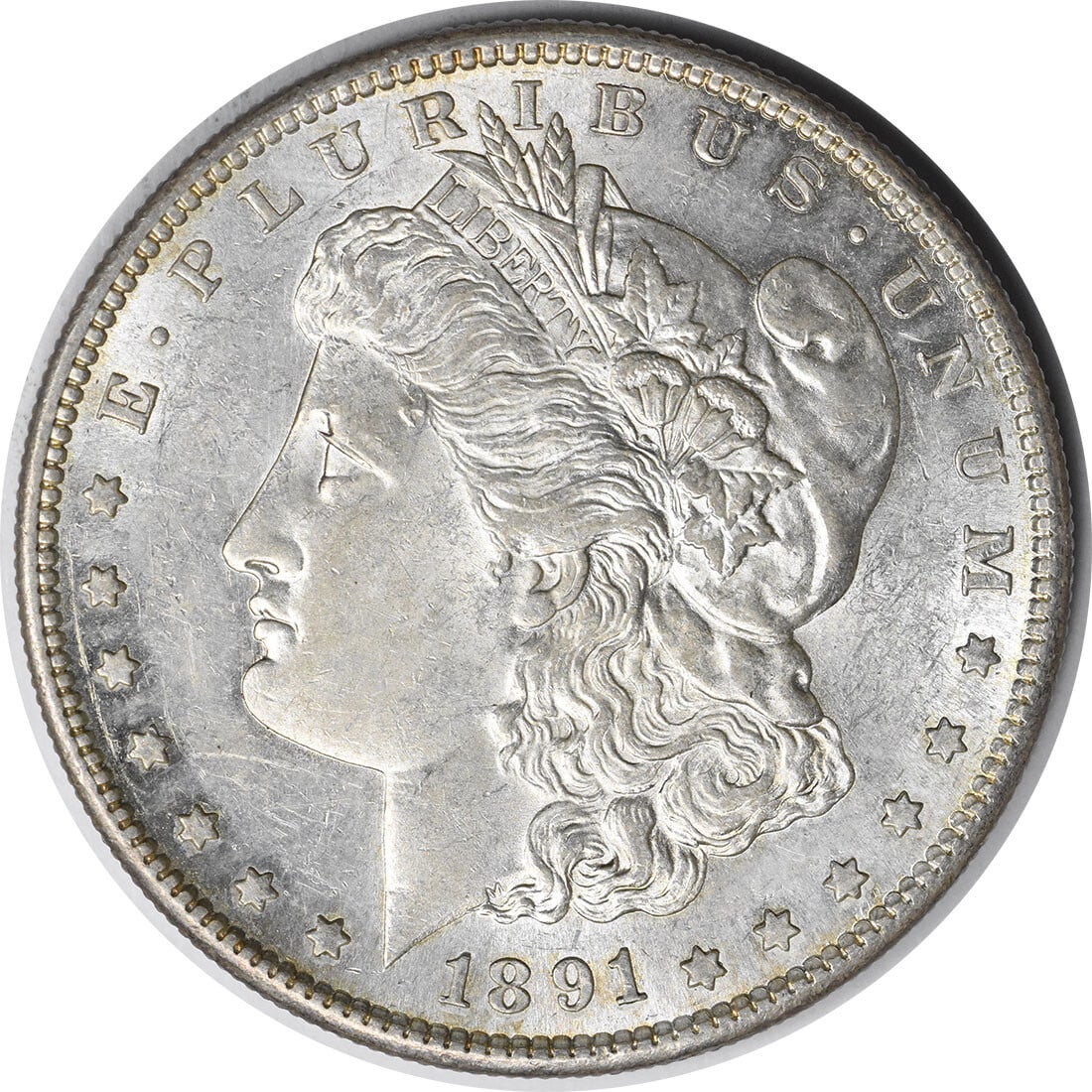 1891-S Morgan Silver Dollar AU Uncertified 90% Silver Coin: 1891-S Morgan Silver Dollar AU Uncertified 90% Silver Coin This 1891-S Morgan Silver Dollar showcases the iconic design by George T. Morgan, featuring a beautiful representation of Liberty on the obve
