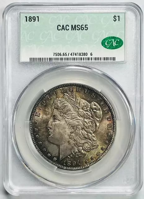 1891 Morgan Silver Dollar CAC Certified MS 65 Coin: 1891 Morgan Silver Dollar CAC Certified MS 65 Coin This 1891 Morgan Silver Dollar is a stunning example of American coinage, certified by CAC with a remarkable grade of MS 65. Struck in silver, this c