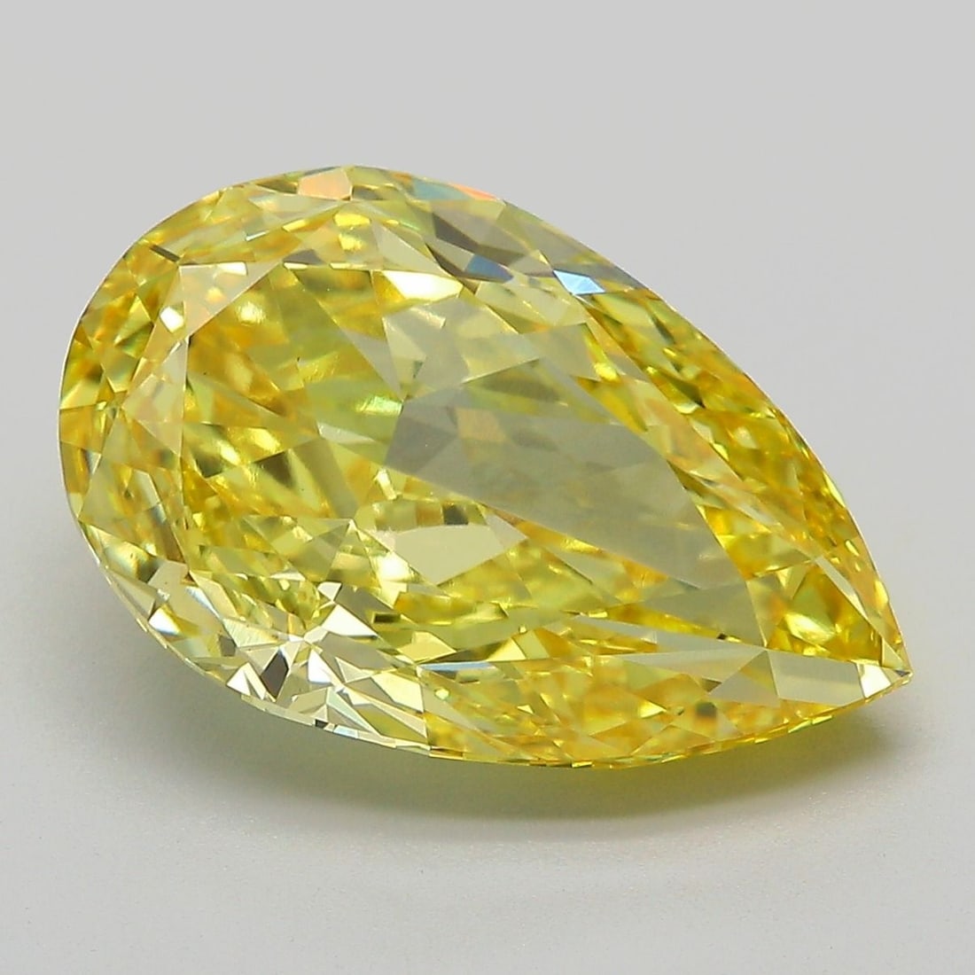 Loose Diamond - PEAR 7.13ct Fancy Vivid Yellow VS1: Loose Diamond - PEAR 7.13ct Fancy Vivid Yellow VS1 Source: This is a real non-mined Diamond that has been grown in a lab Shape: PEAR Carats: 7.13 Color: Fancy Vivid Yellow Certification: IGI Video: