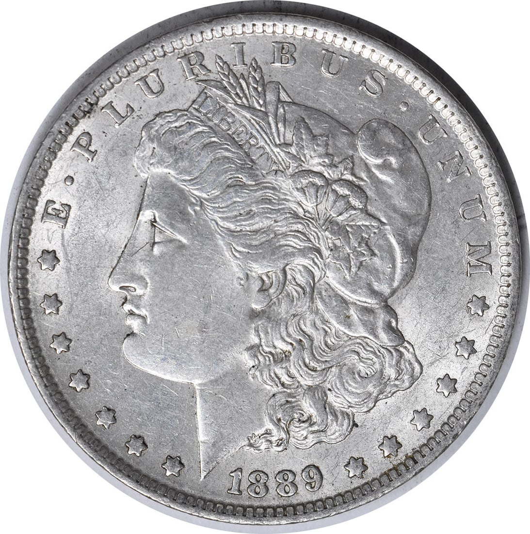 1889-O Morgan Silver Dollar AU Uncertified Coin by George T. Morgan: 1889-O Morgan Silver Dollar AU Uncertified Coin by George T. Morgan This 1889-O Morgan Silver Dollar features a stunning design by George T. Morgan, showcasing the classic profile of Lady Liberty on t