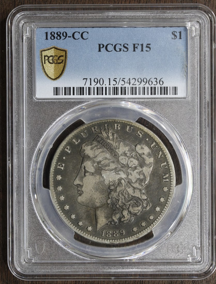 Morgan Dollar 1889 Carson City F15 Silver PCGS Certified Key Date Coin: Morgan Dollar 1889 Carson City F15 Silver PCGS Certified Key Date Coin This 1889-CC Morgan Silver Dollar is a key date coin minted in Carson City. Certified by PCGS and graded F 15, it is composed of