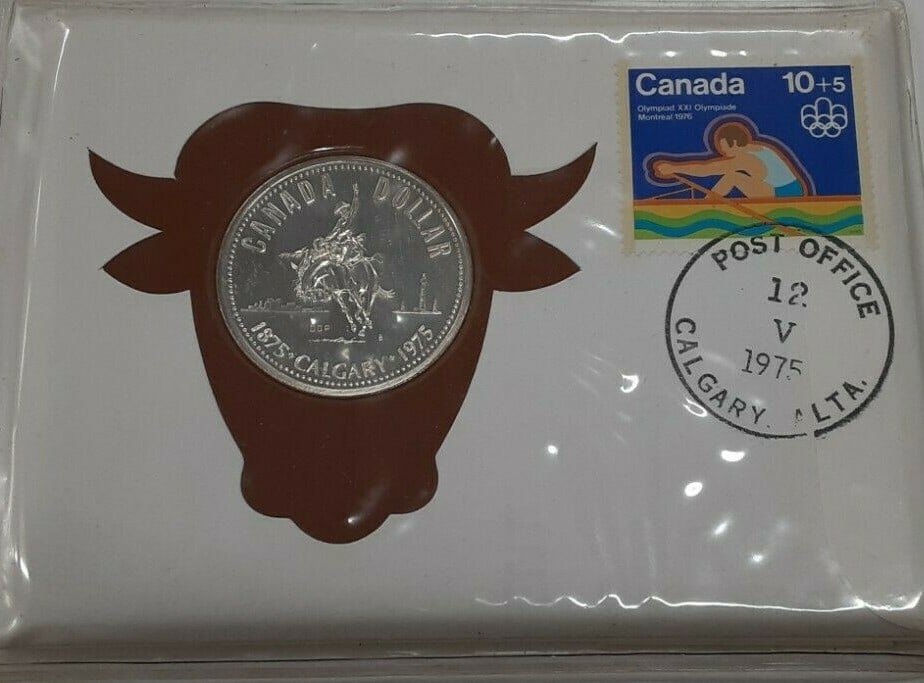 Uncirculated 1975 Canadian 40% Silver Dollar With Stamps in Calgary First Day Cover: Uncirculated 1975 Canadian 40% Silver Dollar With Stamps in Calgary First Day Cover This 1975 Canada One Dollar coin is composed of 40% silver and comes in an uncirculated, proof-like condition. The c