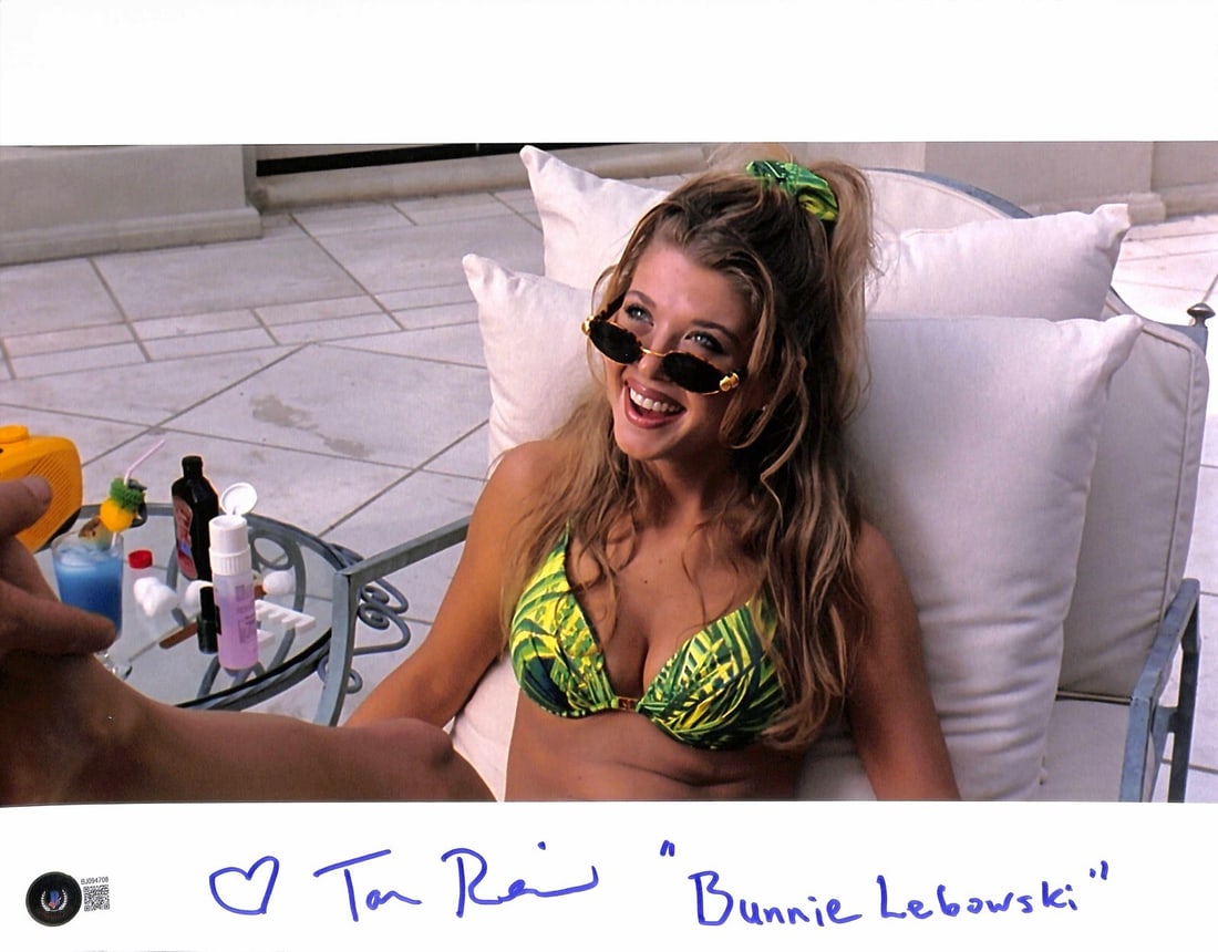 Tara Reid Signed 11x14 Bunny Lebowski Photo Beckett Certified: Tara Reid Signed 11x14 Bunny Lebowski Photo Beckett Certified This is an autographed 11x14 photograph of Tara Reid, who famously portrayed "Bunny Lebowski" in the cult classic film The Big Lebowski. T