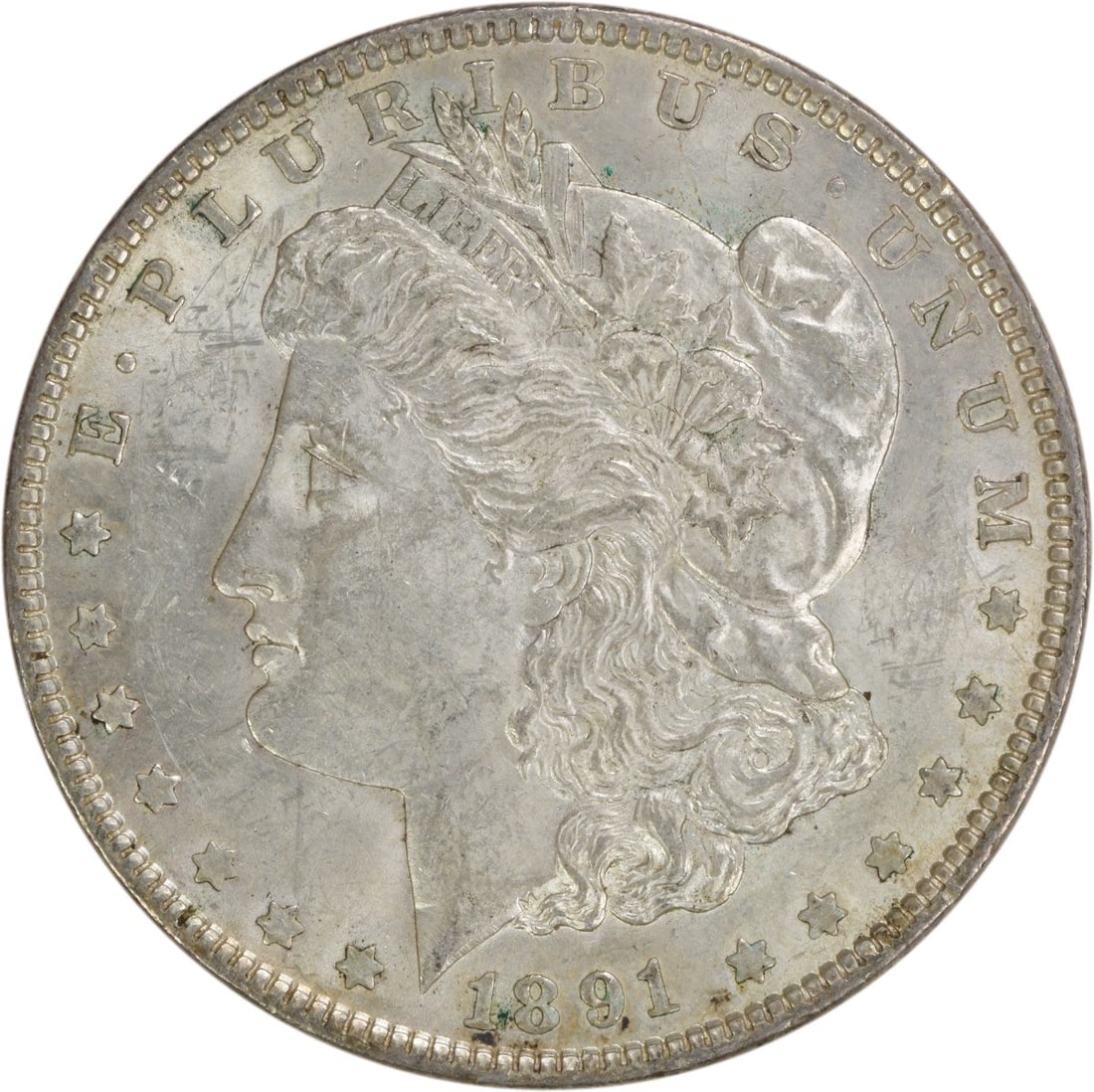 1891 Morgan Silver Dollar AU Uncertified 90% Silver Coin: 1891 Morgan Silver Dollar AU Uncertified 90% Silver Coin This 1891 Morgan Silver Dollar is a beautiful example of American numismatic history. With an AU (About Uncirculated) grade, this coin showcase