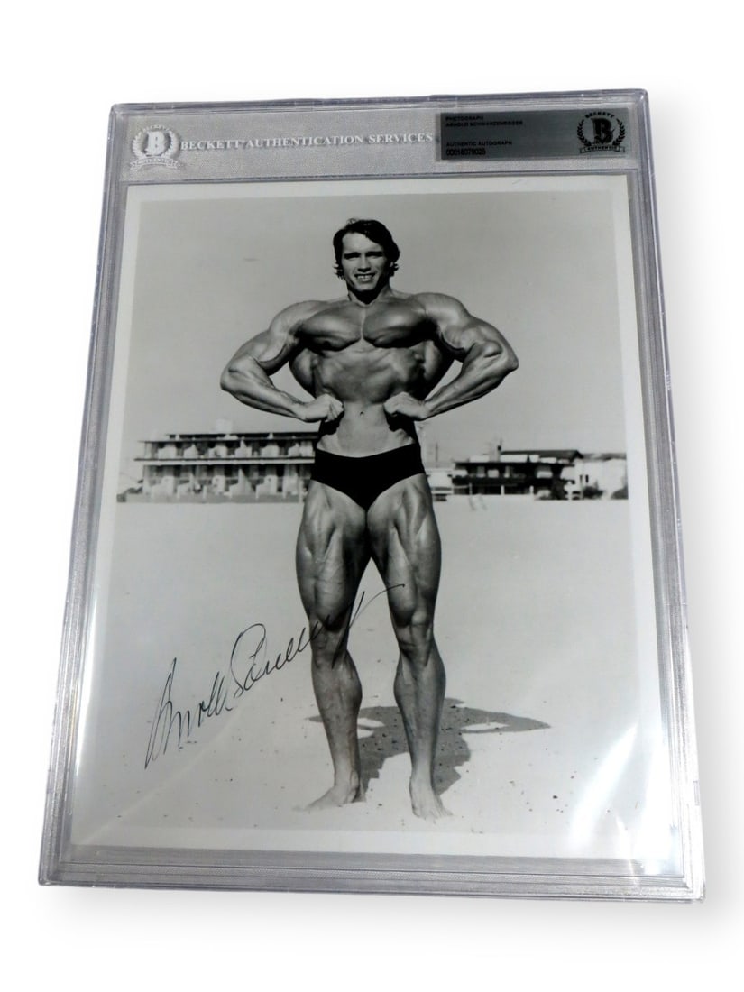 Arnold Schwarzenegger Signed 8X10 Photo Beckett Authenticated Vintage Beach Pose: Arnold Schwarzenegger Signed 8X10 Photo Beckett Authenticated Vintage Beach Pose This is an original autographed 8x10 photograph of Arnold Schwarzenegger, showcasing a vintage beach pose. The photogra