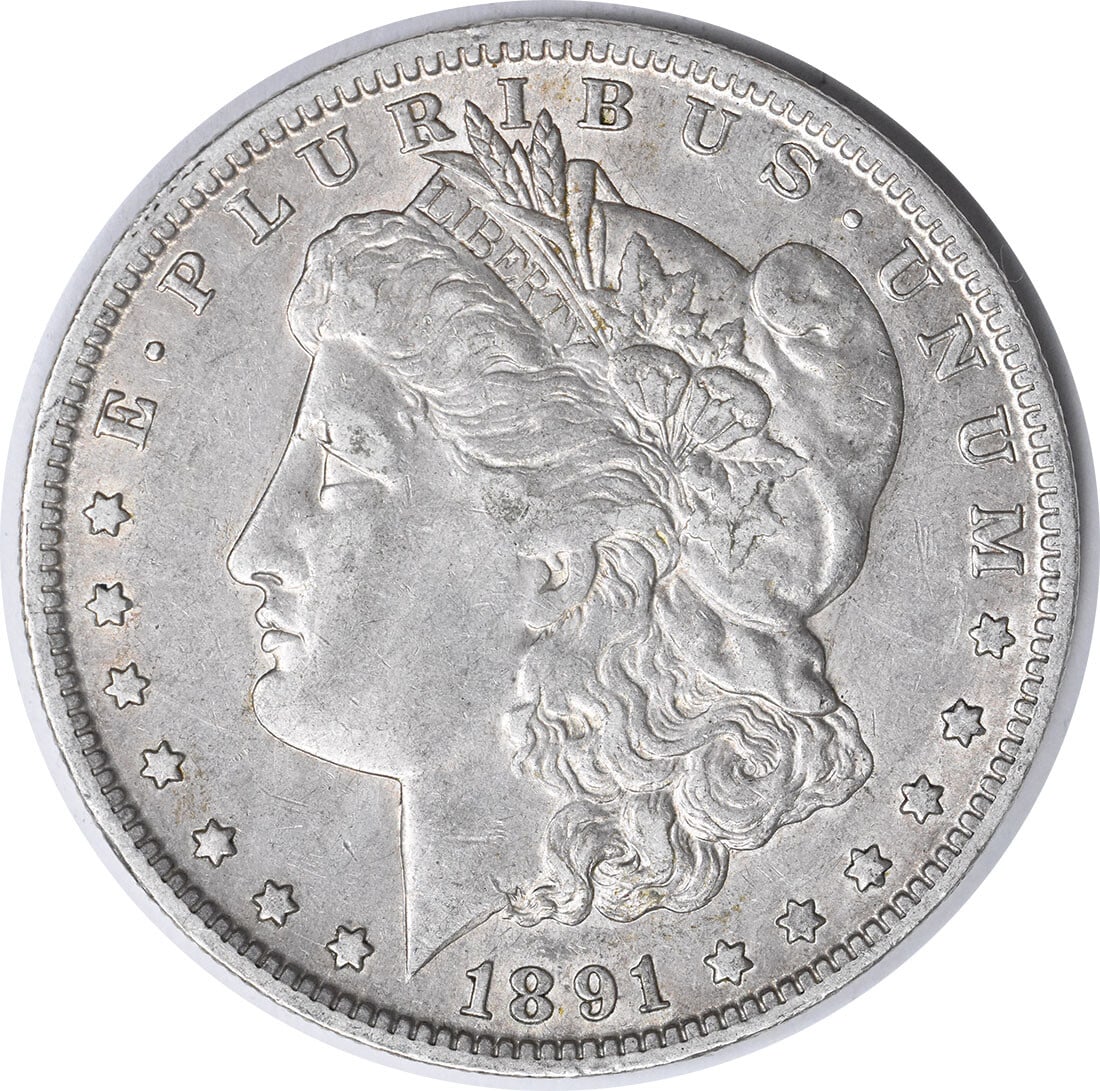 1891-O Morgan Silver Dollar 90% Silver XF Coin George T Morgan: 1891-O Morgan Silver Dollar 90% Silver XF Coin George T Morgan This 1891-O Morgan Silver Dollar is a remarkable piece for collectors, showcasing the artistry of designer George T. Morgan. With a compo