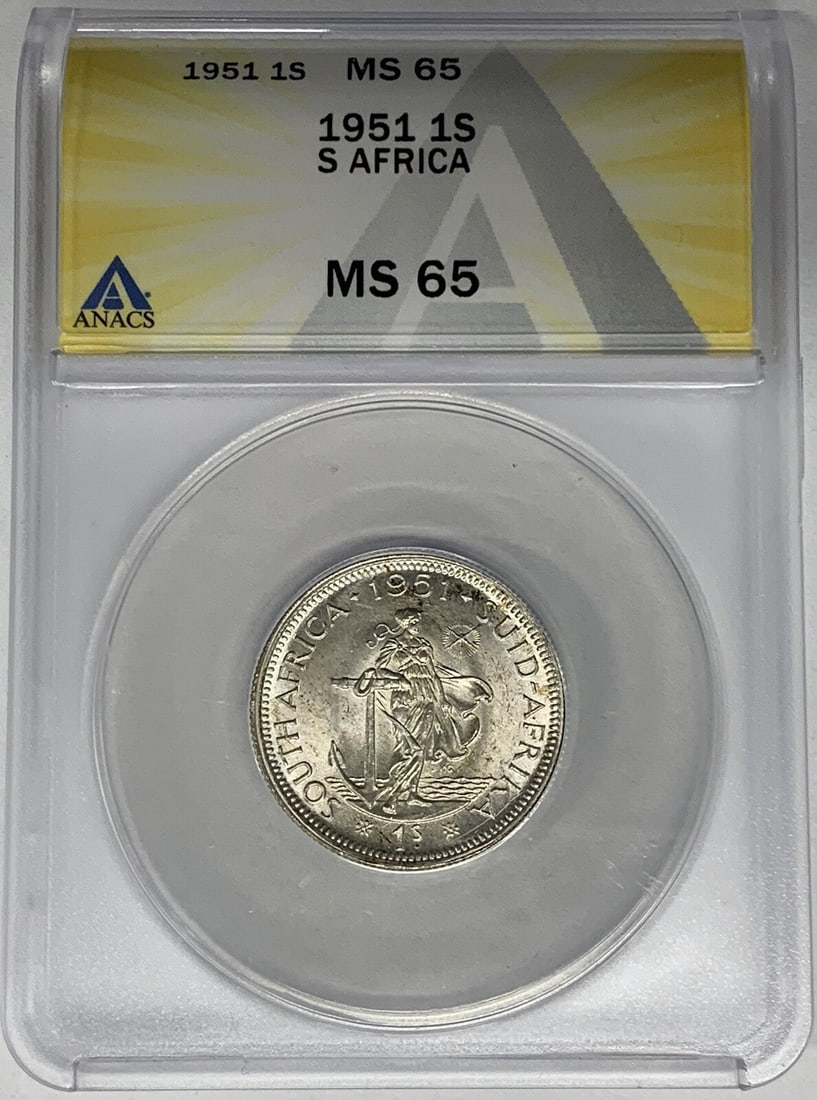 1951 Silver 1 Shilling Coin from South Africa Graded MS 65 by ANACS: 1951 Silver 1 Shilling Coin from South Africa Graded MS 65 by ANACS This 1951 South Africa 1 Shilling coin is composed of silver and has been graded as MS 65 by ANACS. It is a certified collectible in