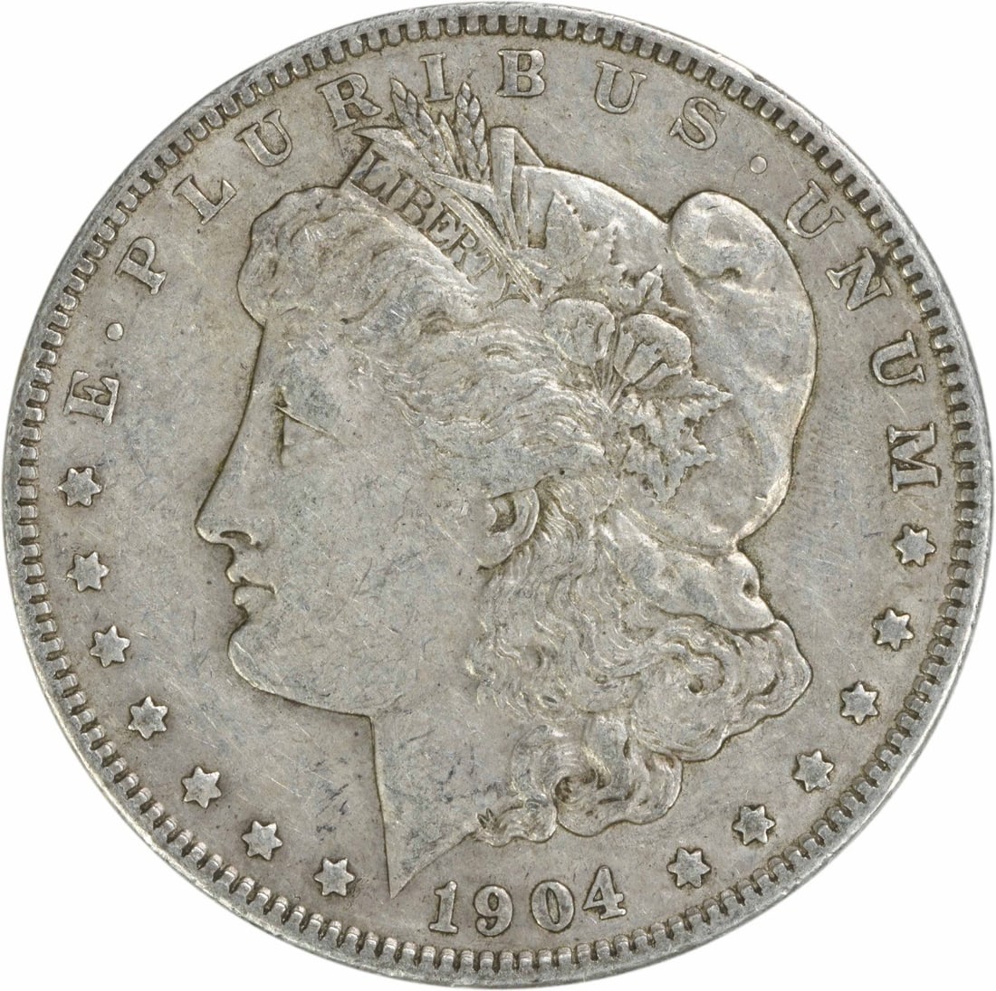 1904 Morgan Silver Dollar EF 90% Silver Uncertified Coin: 1904 Morgan Silver Dollar EF 90% Silver Uncertified Coin This 1904 Morgan Silver Dollar showcases the remarkable craftsmanship of designer George T. Morgan. Struck in Philadelphia, this coin is compos