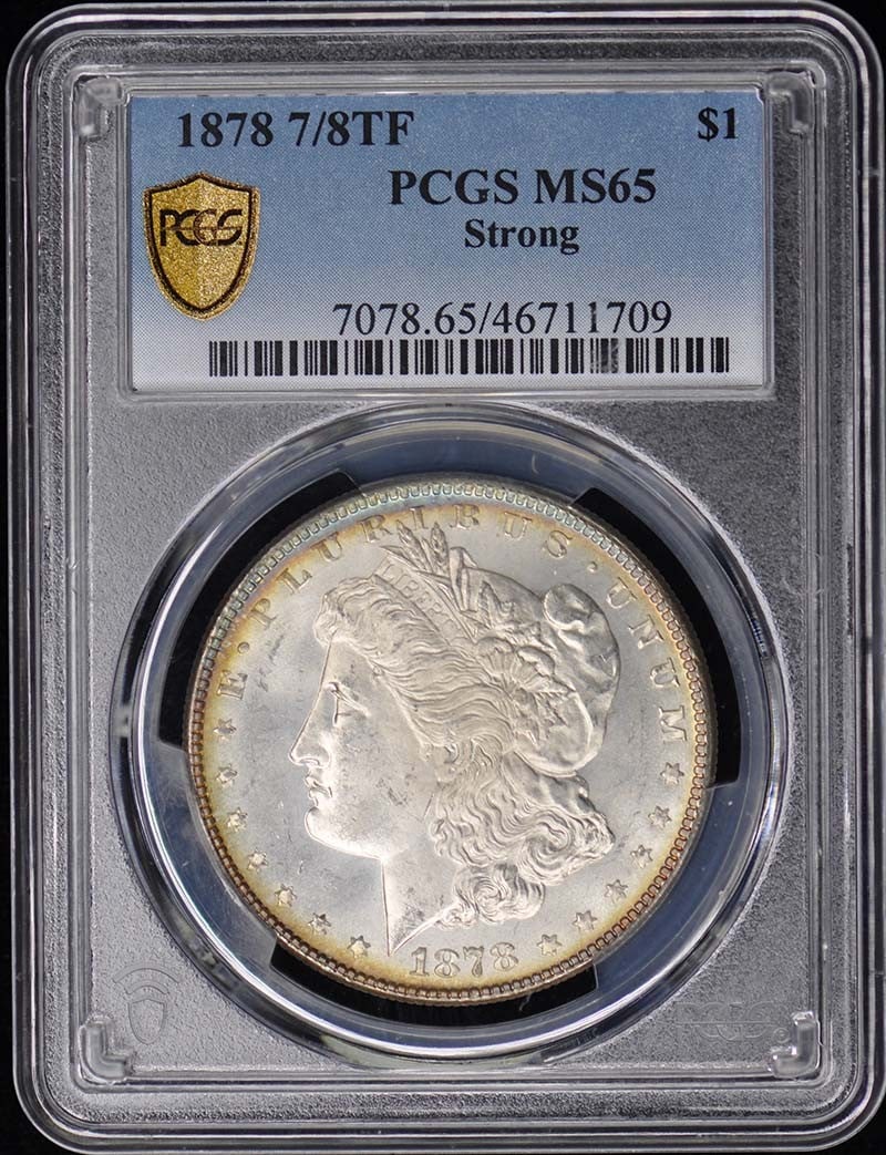 1878 Morgan Dollar PCGS MS65 Uncirculated Philadelphia Coin: 1878 Morgan Dollar PCGS MS65 Uncirculated Philadelphia Coin This 1878 Morgan Dollar showcases exceptional quality, graded MS65 by PCGS, ensuring it is a highly collectible piece for any numismatist.
