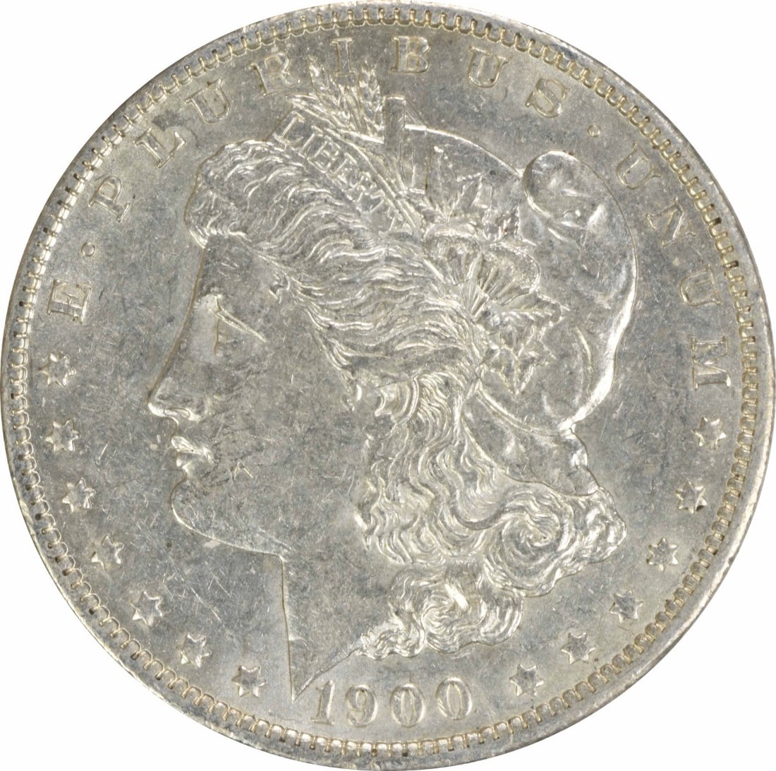 1900-O Morgan Silver Dollar AU Uncertified 90% Silver Coin: 1900-O Morgan Silver Dollar AU Uncertified 90% Silver Coin This 1900-O Morgan Silver Dollar is a stunning example of American coinage, featuring a design by George T. Morgan. Struck at the New Orleans
