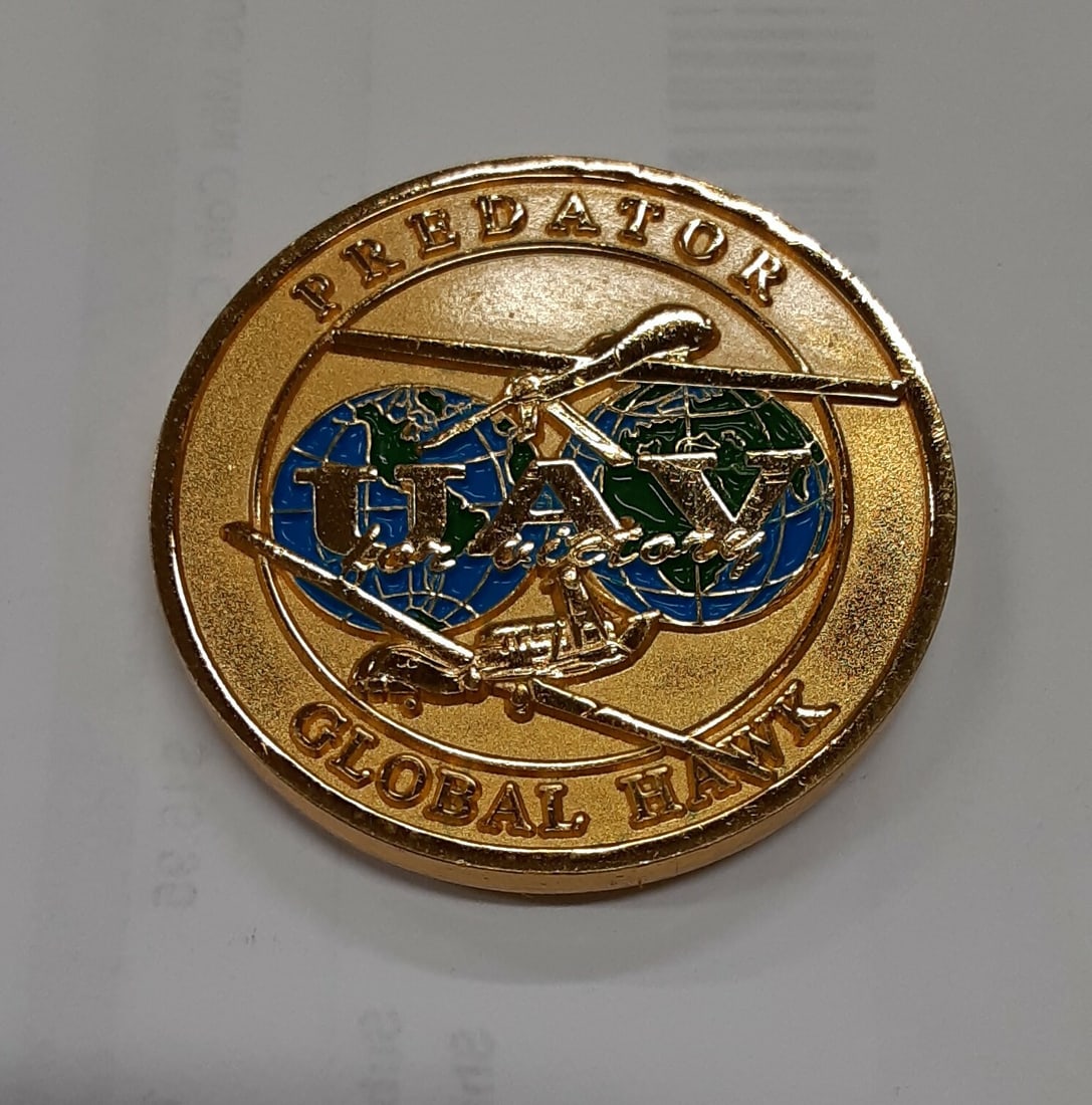 C I A Predator Global Hawk UAV Challenge Coin United States: C I A Predator Global Hawk UAV Challenge Coin United States This Predator-Global Hawk UAV/Central Intelligence Agency challenge coin features vibrant enamel detailing and bright colors. The coin is pr